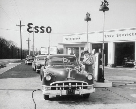 ATTENDANT AT ESSO SERVING CUSTOMER, CIRCA 1949 - Wall Art - By Archive Holdings Inc.- Gallery Art Company